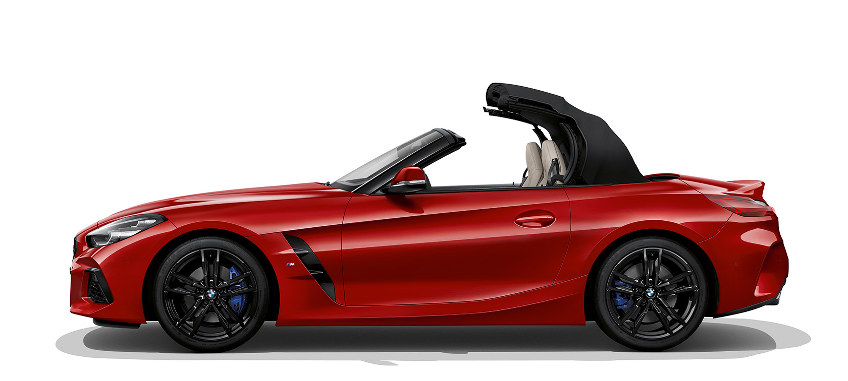 A BMW Z4 Roadster oldalnézetből A BMW Z4 Roadster oldalnézetből, éppen kinyíló tetővel